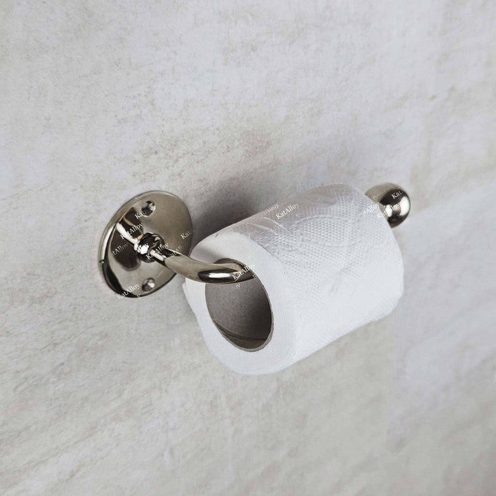 Chrome toilet paper holder with a roll of toilet paper on a light gray background