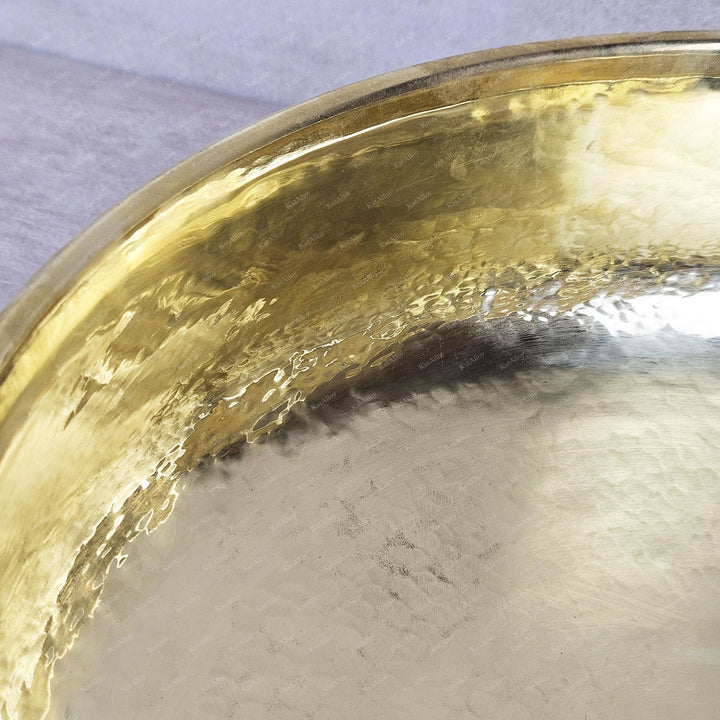 Gold decorative item on a textured surface