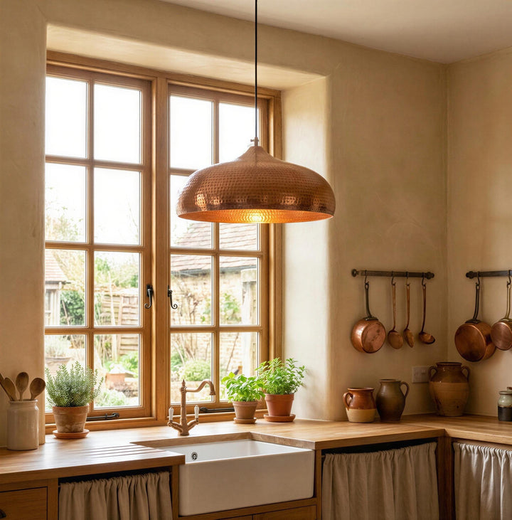 Kitchen with wooden pendant light, window, and hanging pots